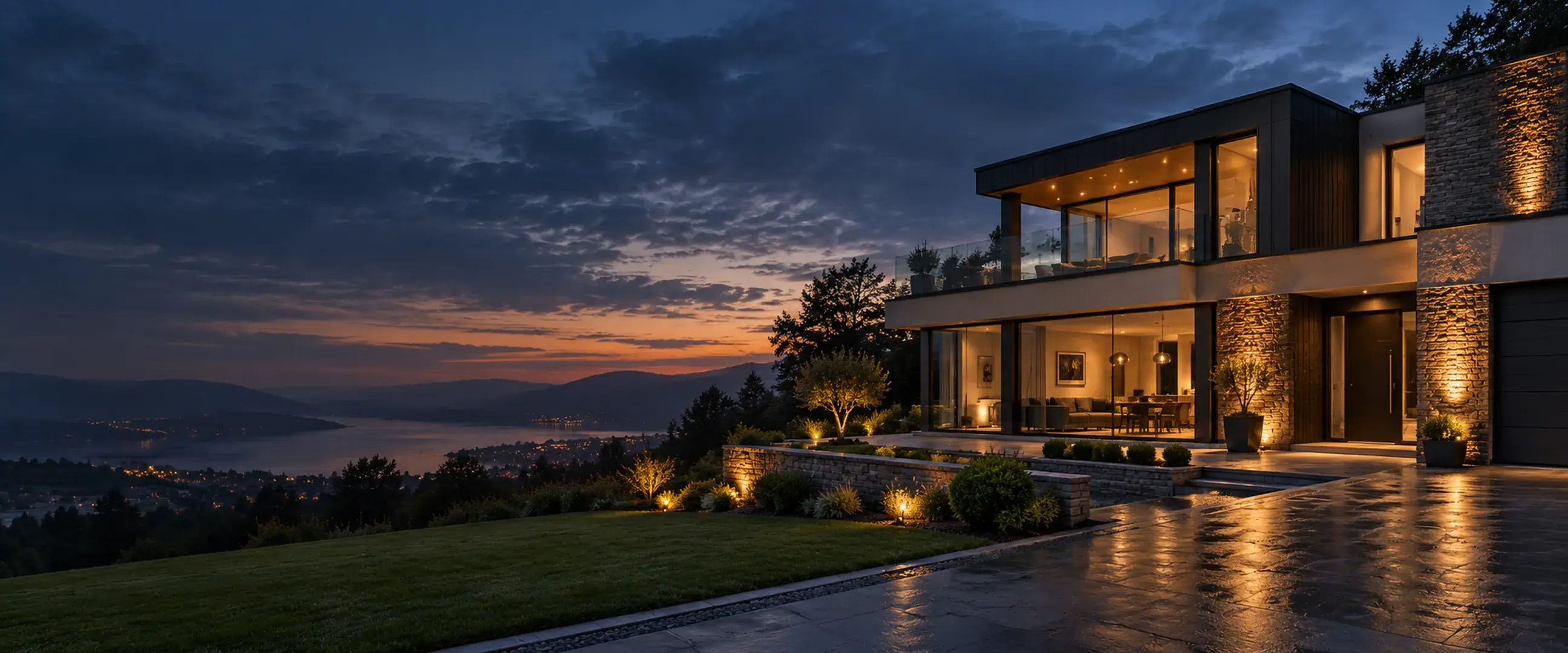 Modern home with illuminated rooms at dusk